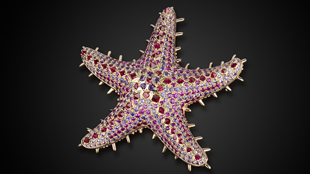 Sea star pendant featuring ruby, sapphire, spinel, and amethyst. Sea star pendant featuring ruby, sapphire, spinel, and amethyst.