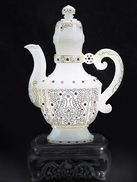 White nephrite jade pot inlaid with gold wire, ruby, and sapphire. White nephrite jade pot inlaid with gold wire, ruby, and sapphire.