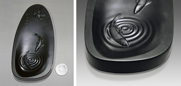 A three-shaft CNC machine engraved the fine details on this dark nephrite ink slab. A three-shaft CNC machine engraved the fine details on this dark nephrite ink slab.