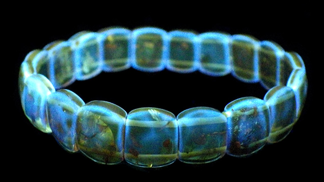 Amber bracelet with bright blue fluorescence.