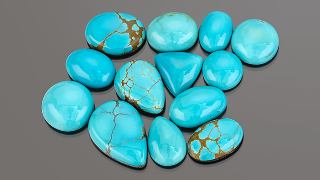 Figure 3. Stabilized Nevada turquoise from the Supernova mine. Sizes range from 5.61 to 13.09 ct. Photo by Robert Weldon; courtesy of Out of Our Mines.