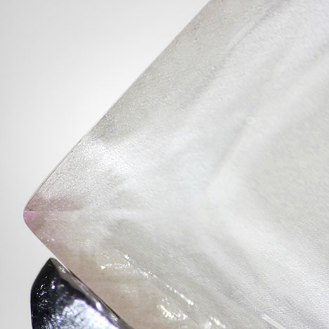 Figure 2. After the crown was separated from the pavilion of sample PM01, the observed color was concentrated on the outer edge, and the middle area was colorless. Photo by Tsung-Jen Wu. Figure 2. After the crown was separated from the pavilion of sample PM01, the observed color was concentrated on the outer edge, and the middle area was colorless. Photo by Tsung-Jen Wu.