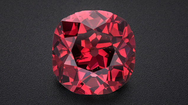 Figure 1. The 2.33 ct Winston Red diamond, displaying a vibrant Fancy red color. The old mine brilliant-cut stone measures approximately 8 mm in diameter. Photo by Robert Weldon; courtesy of Ronald Winston. Figure 1. The 2.33 ct Winston Red diamond, displaying a vibrant Fancy red color. The old mine brilliant-cut stone measures approximately 8 mm in diameter. Photo by Robert Weldon; courtesy of Ronald Winston.