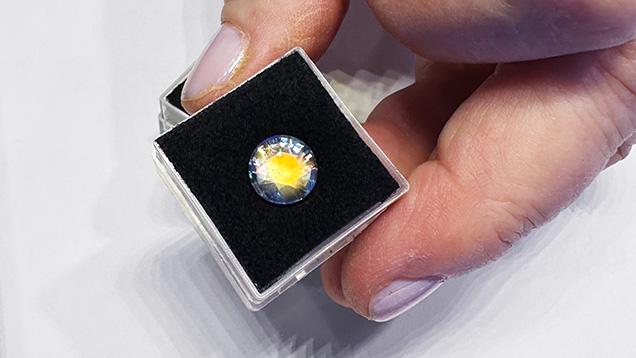 Figure 5. A 9.5 mm, 3.25 ct rainbow moonstone with orange flash and blue adularescence from Madagascar. Photo by Jennifer Stone-Sundberg; courtesy of Mayer & Watt. Figure 5. A 9.5 mm, 3.25 ct rainbow moonstone with orange flash and blue adularescence from Madagascar. Photo by Jennifer Stone-Sundberg; courtesy of Mayer & Watt.