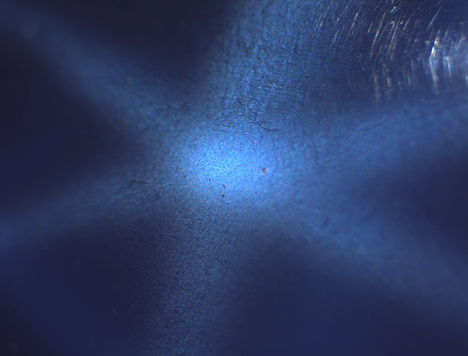 Needle-like inclusions causing asterism in synthetic sapphire. Needle-like inclusions causing asterism in synthetic sapphire.