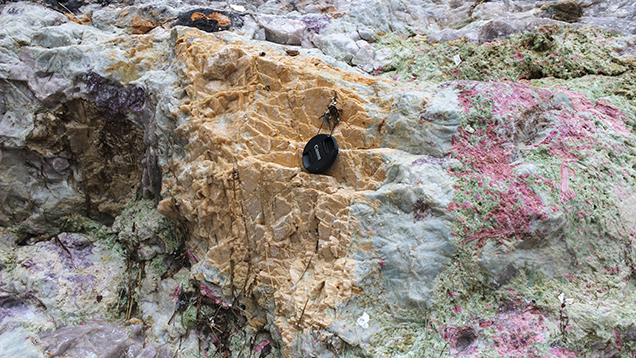 Tourmaline, clevelandite, lepidolite, and “salmon”-colored feldspar at the Havey Quarry. Tourmaline, clevelandite, lepidolite, and “salmon”-colored feldspar at the Havey Quarry.