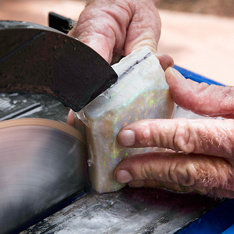 Making the first cut on a rough opal Making the first cut on a rough opal