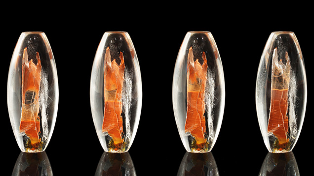 The tiny brown particles are mobile within the quartz host. The tiny brown particles are mobile within the quartz host.