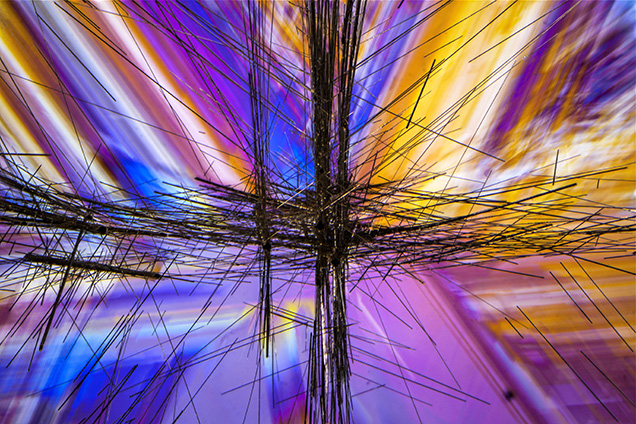 Brazil-law twinning in quartz shown through cross-polarized light. Brazil-law twinning in quartz shown through cross-polarized light.