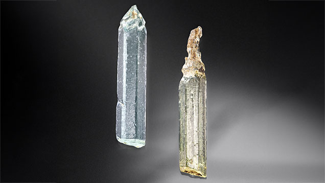 Figure 1. These aquamarine (left) and heliodor (right) crystals reported to be from China, measuring approximately 2 cm long and 0.4 cm wide, display distinctive etch pits. Photo by Adriana Robinson. Gift of Zeng Jiliang, GIA Museum nos. 20633 (left) and 20630 (right). Figure 1. These aquamarine (left) and heliodor (right) crystals reported to be from China, measuring approximately 2 cm long and 0.4 cm wide, display distinctive etch pits. Photo by Adriana Robinson. Gift of Zeng Jiliang, GIA Museum nos. 20633 (left) and 20630 (right).