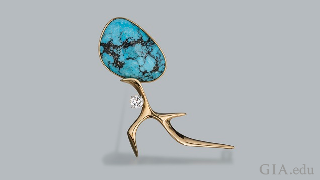 Apiece of turquoise with matrix comprises the head that sites on the yellow gold figure. Apiece of turquoise with matrix comprises the head that sites on the yellow gold figure.