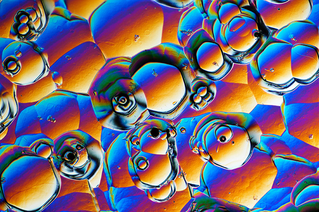 Sub-hexagonal etch pits in synthetic moissanite.