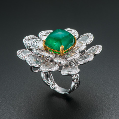 A 12.09 ct sugar-loaf cabochon emerald A 12.09 ct sugar-loaf cabochon emerald