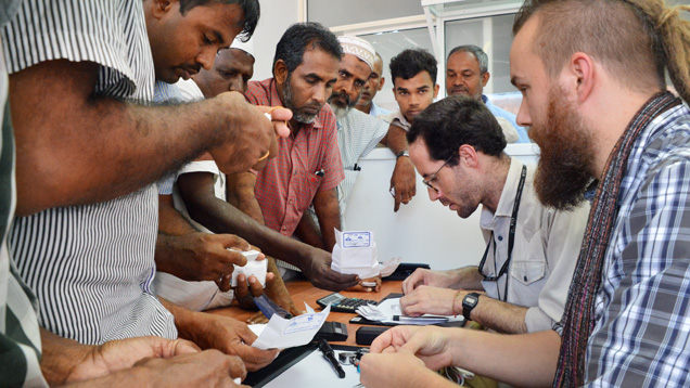 Field gemologist inspects sapphires in Sri Lanka