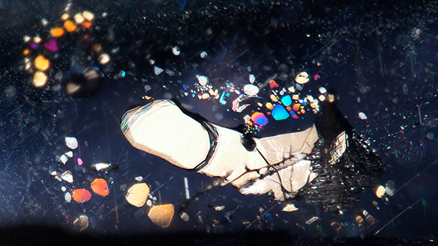 Mogok sapphire with negative crystal surrounded by iridescent thin films Mogok sapphire with negative crystal surrounded by iridescent thin films