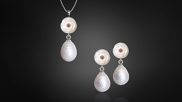 Figure 20. White freshwater pearl “carnations” accented with rubies and set in 14K white gold with teardrop-shaped Momento pearls, each holding a tiny NFC chip ready to store a variety of digital assets and precious memories. Courtesy of Chi Huynh. Figure 20. White freshwater pearl “carnations” accented with rubies and set in 14K white gold with teardrop-shaped Momento pearls, each holding a tiny NFC chip ready to store a variety of digital assets and precious memories. Courtesy of Chi Huynh.