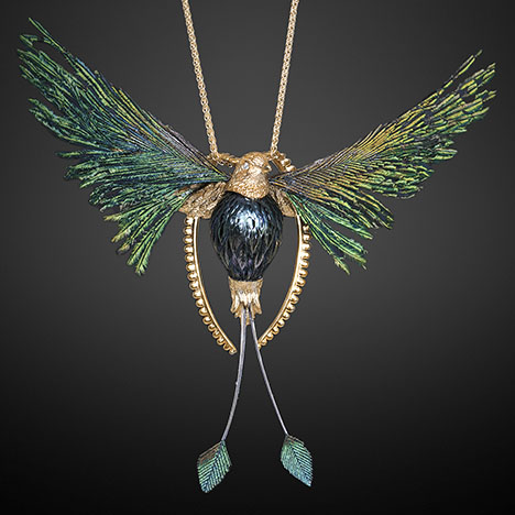 Figure 8. The “Lightness of Being” pendant symbolizes freedom and was inspired by Huynh’s favorite bird. The main 15 × 11 mm Tahitian pearl body was hand-carved to imitate the body of a peacock, and the pearl’s color matches its feathers. Courtesy of Chi Huynh. Figure 8. The “Lightness of Being” pendant symbolizes freedom and was inspired by Huynh’s favorite bird. The main 15 × 11 mm Tahitian pearl body was hand-carved to imitate the body of a peacock, and the pearl’s color matches its feathers. Courtesy of Chi Huynh.