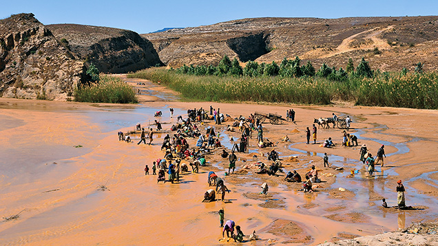 Figure 8. Local people washing for sapphires in 2010 near the village of Ambalavy 50 km southwest of Ilakaka in south-central Madagascar. Photo by Vincent Pardieu. Figure 8. Local people washing for sapphires in 2010 near the village of Ambalavy 50 km southwest of Ilakaka in south-central Madagascar. Photo by Vincent Pardieu.