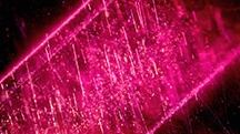 Figure 1. This Mozambique ruby contains needles and bands of particles before heating (left). The inclusions did not show any signs of alteration after heating at 900°C for 5 hours in air (right). However, the development of the 3309 cm–1 series in the FTIR spectrum was detected in this stone after heating, providing evidence of low-temperature heat treatment. Photomicrographs by Suwasan Wongchacree; field of view 1.75 mm. Figure 1. This Mozambique ruby contains needles and bands of particles before heating (left). The inclusions did not show any signs of alteration after heating at 900°C for 5 hours in air (right). However, the development of the 3309 cm–1 series in the FTIR spectrum was detected in this stone after heating, providing evidence of low-temperature heat treatment. Photomicrographs by Suwasan Wongchacree; field of view 1.75 mm.