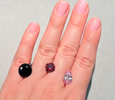 The Winston Red diamond (center), alongside the “red-brown” DeYoung Red (left, 5.03 ct) and the DeYoung Pink diamonds (right, 2.82 ct). All three stones are currently on public exhibit at the Smithsonian NMNH. Photo by Gabriela Farfan. The Winston Red diamond (center), alongside the “red-brown” DeYoung Red (left, 5.03 ct) and the DeYoung Pink diamonds (right, 2.82 ct). All three stones are currently on public exhibit at the Smithsonian NMNH. Photo by Gabriela Farfan.