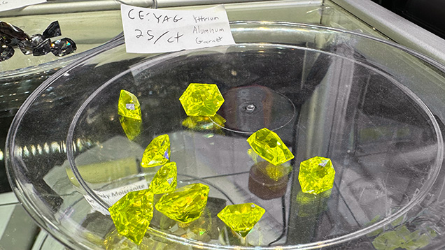 Figure 1. Yellow to greenish yellow faceted cerium-doped YAG “lumogarnets” ranging from 4 to 12 ct apiece. Photo by Lisa Kennedy; courtesy of Turtle’s Hoard.