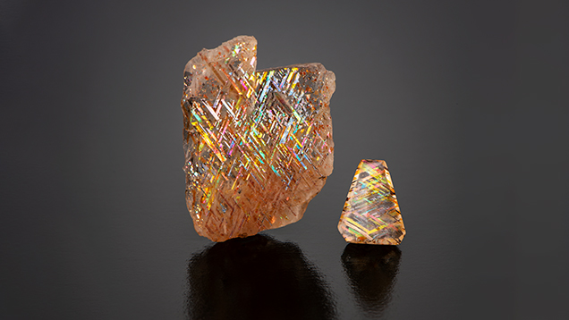 Courtesy of Rainbow Lattice, AustraliaThese two gems are rainbow lattice feldspar, weighing 20.74 carats and 2.18 carats. They feature distinctive lattice-like inclusions of magnetite or hematite, often accompanied by iridescent flashes of color known as aventurescence, making them prized for their rare and mesmerizing appearance. Courtesy of Rainbow Lattice, AustraliaThese two gems are rainbow lattice feldspar, weighing 20.74 carats and 2.18 carats. They feature distinctive lattice-like inclusions of magnetite or hematite, often accompanied by iridescent flashes of color known as aventurescence, making them prized for their rare and mesmerizing appearance.