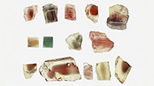 Figure 1. The 29 natural labradorite sunstone and plagioclase feldspar specimens used in this study. Groups A and C are from Oregon, United States; group B is from Inner Mongolia, China; and group D is from Afar, Ethiopia. In Group C, the top five stones are from the Ponderosa mine, the middle three samples (first one imaged in two orientations) are from the Sunstone Butte mine, and the bottom five samples are from the Dust Devil mine. Photos by Qingchao Zhou. Figure 1. The 29 natural labradorite sunstone and plagioclase feldspar specimens used in this study. Groups A and C are from Oregon, United States; group B is from Inner Mongolia, China; and group D is from Afar, Ethiopia. In Group C, the top five stones are from the Ponderosa mine, the middle three samples (first one imaged in two orientations) are from the Sunstone Butte mine, and the bottom five samples are from the Dust Devil mine. Photos by Qingchao Zhou.