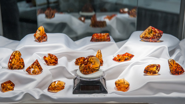 Citrine carvings by gem designer Michael Dyber adorn a showcase at a Tucson gem show. - Eric Welch, courtesy Michael Dyber Citrine carvings by gem designer Michael Dyber adorn a showcase at a Tucson gem show. - Eric Welch, courtesy Michael Dyber