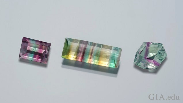 There pieces of faceted fluorites (square, rectangle and octagonal) show pink, purple, green, yellow and turquoise bands of color. There pieces of faceted fluorites (square, rectangle and octagonal) show pink, purple, green, yellow and turquoise bands of color.