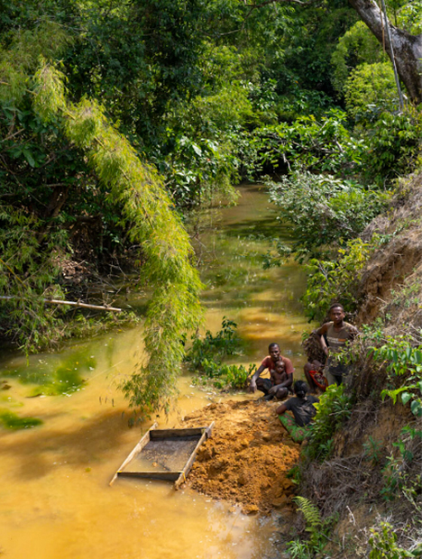 Three miners by river in Madagascar. Three miners by river in Madagascar.