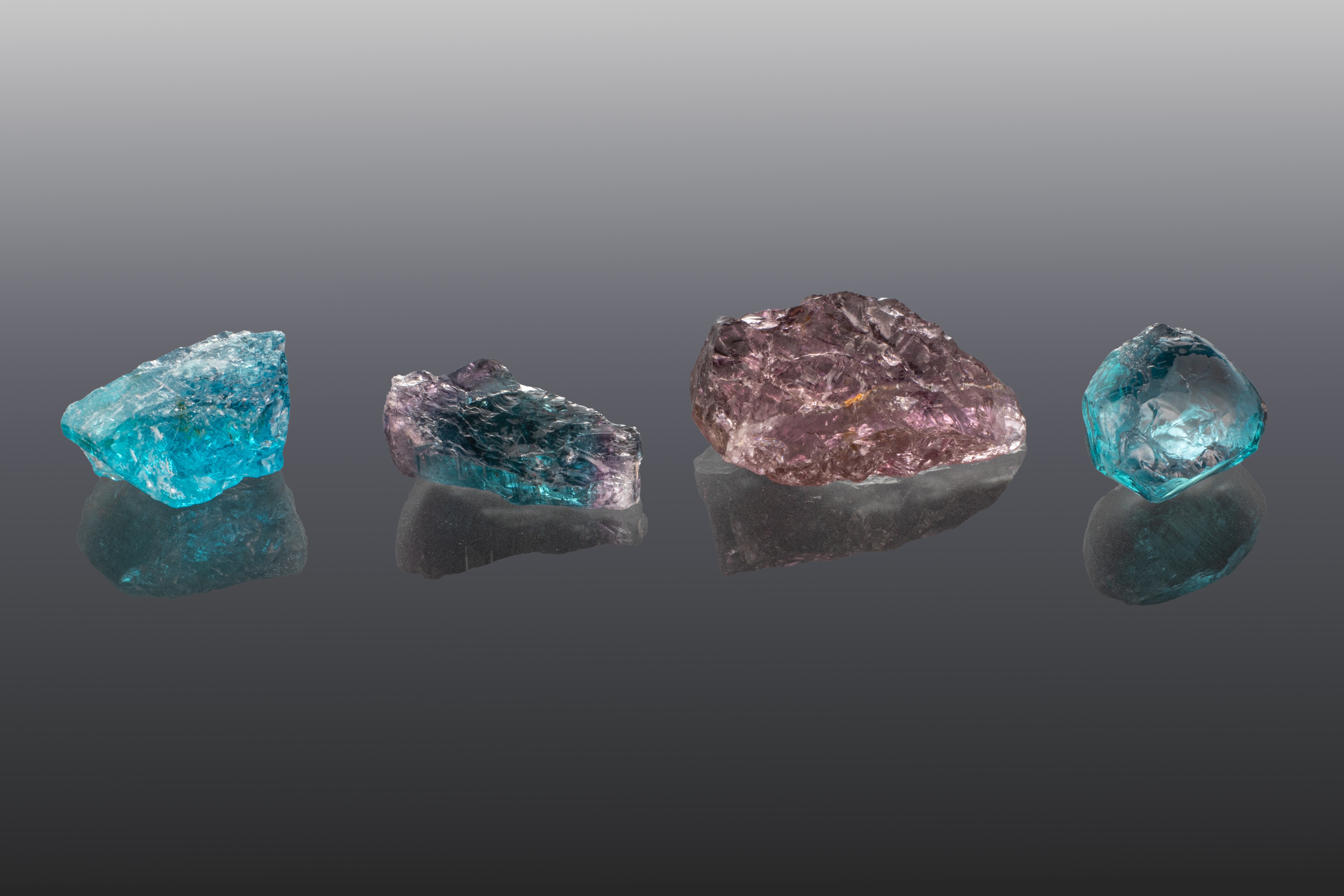 Rough stones from the new Ethiopian tourmaline deposit displaying the range of color for the stones being produced. Stones weigh from 4.20 cts to 10.95 cts. Courtesy of the Ferreira Group. Photo by Annie Haynes/GIA.