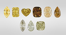 Figure 1. Yellow is the most common color in 480 nm band diamonds and can occur in different tones and saturations (top row, three on the left). The 480 nm band diamond family also includes those with brown and orange colors (top row, three on the right), as well as chameleon diamonds with a green color component (bottom row). Photos by GIA staff. Figure 1. Yellow is the most common color in 480 nm band diamonds and can occur in different tones and saturations (top row, three on the left). The 480 nm band diamond family also includes those with brown and orange colors (top row, three on the right), as well as chameleon diamonds with a green color component (bottom row). Photos by GIA staff.