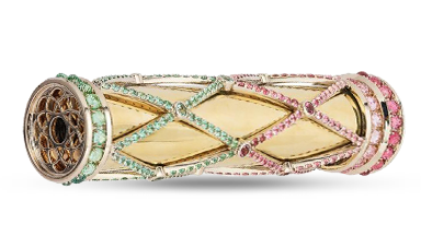 Lattice-patterned gems encase an 18K gold kaleidoscope. Lattice-patterned gems encase an 18K gold kaleidoscope.