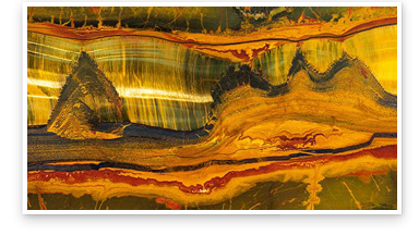 Close up view of a large, polished slab of quartz variety Tiger’s Eye from the Marra Mamba region of Western Australia. It measures at 10 feet long, 20 inches wide and 2 inches thick. Photo: Emily Lane/GIA Close up view of a large, polished slab of quartz variety Tiger’s Eye from the Marra Mamba region of Western Australia. It measures at 10 feet long, 20 inches wide and 2 inches thick. Photo: Emily Lane/GIA